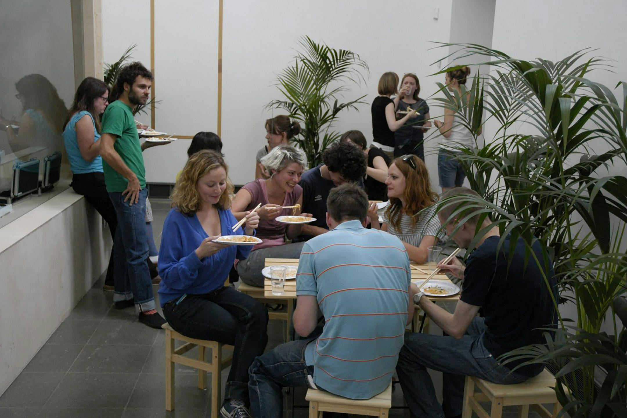 Installation view of viewers interacting within the exhibition Rirkrit Tiravinija at Serpentine Gallery, London, dated 2005.