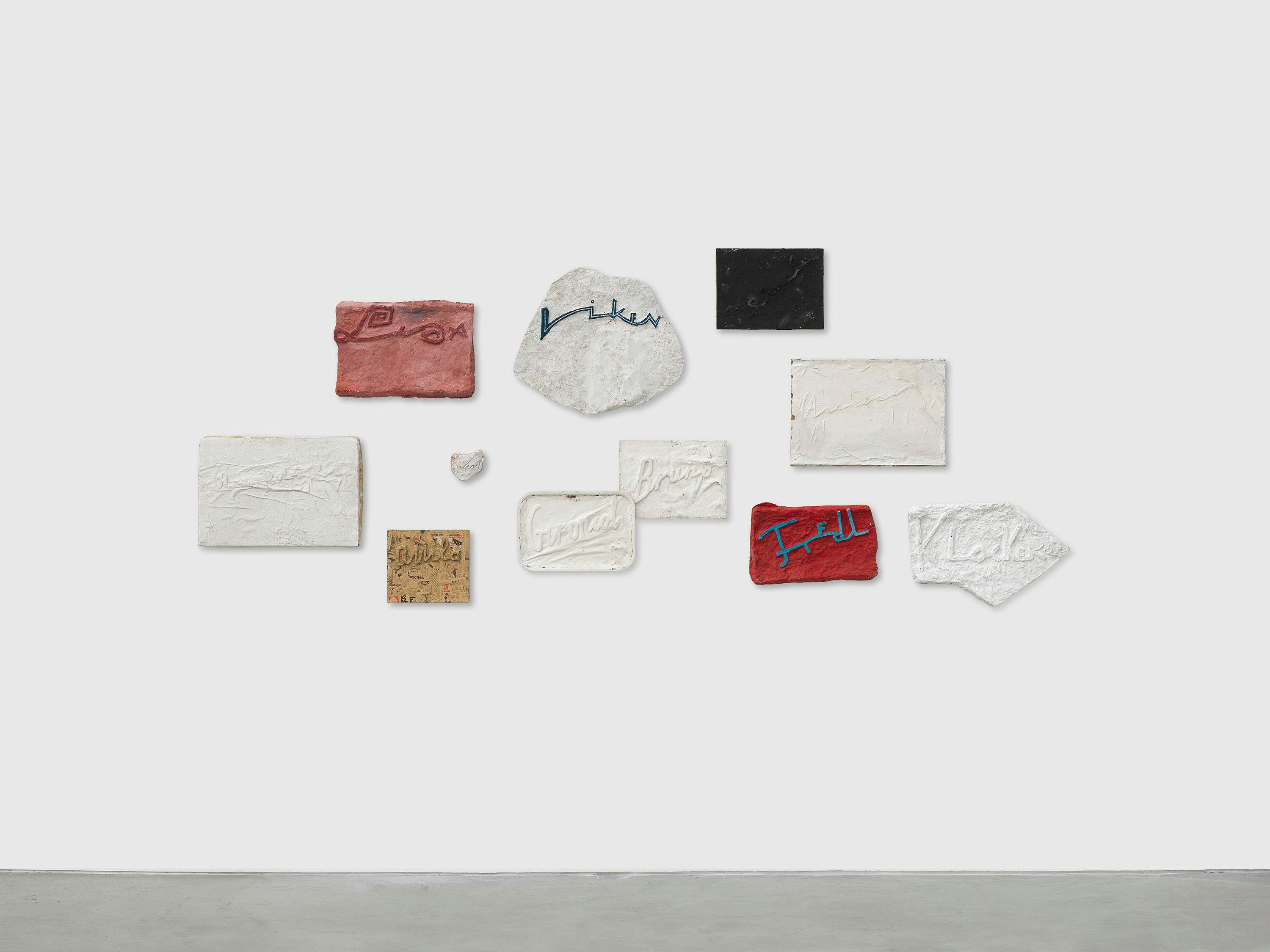 A mixed media wall installation by Franz West, titled Namensbilder, dated 1974 to 1985.