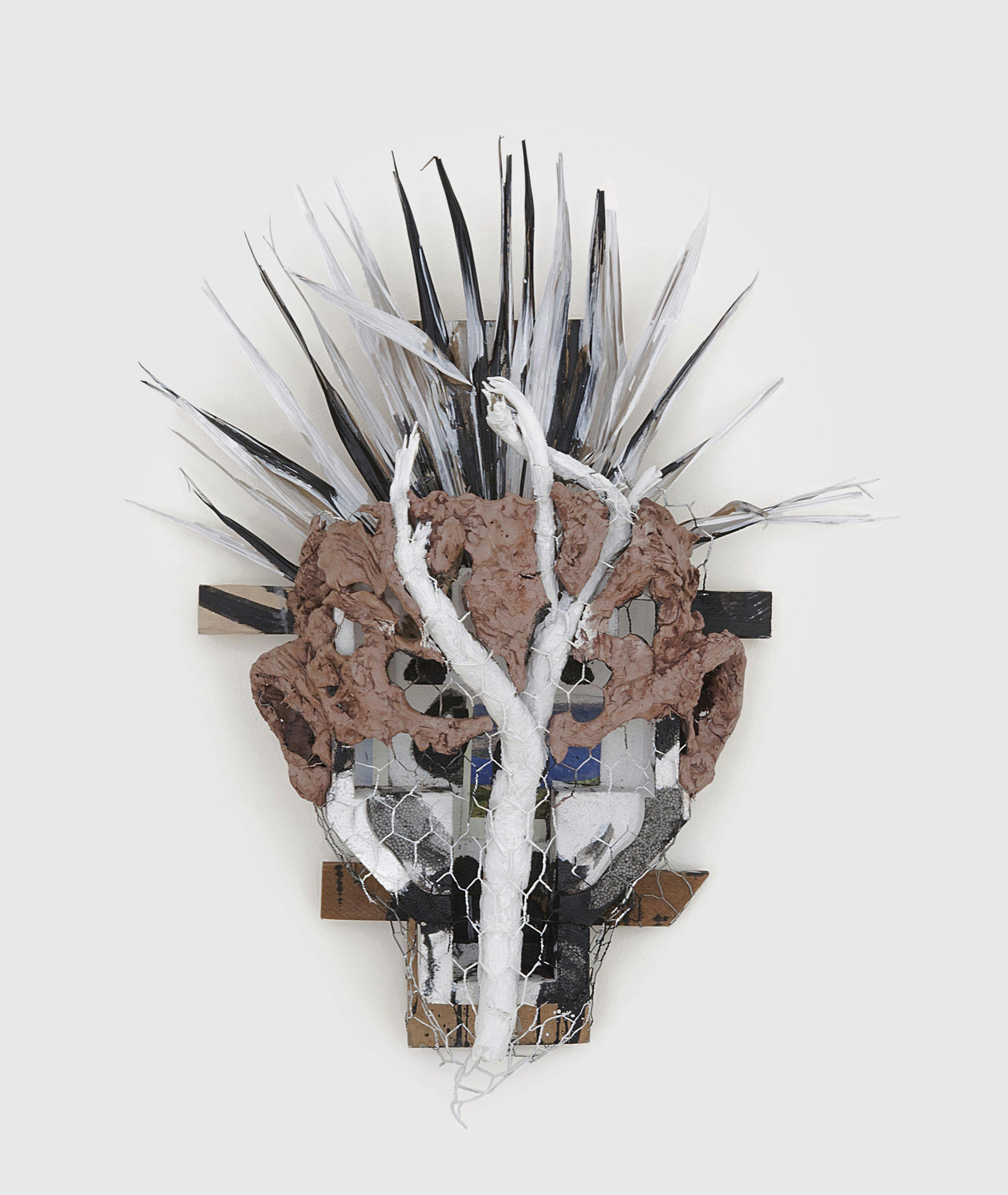 A wood, Styrofoam, clay, wire, paper, acrylic paint, and palm artwork by Huma Bhabha, titled Alfonso, dated 2013.