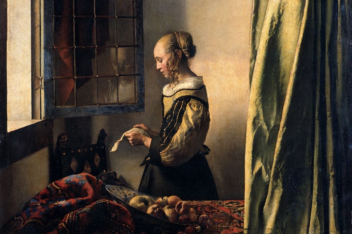 A detail of an artwork by Johannes Vemeer titled Girl Reading a letter at an open window