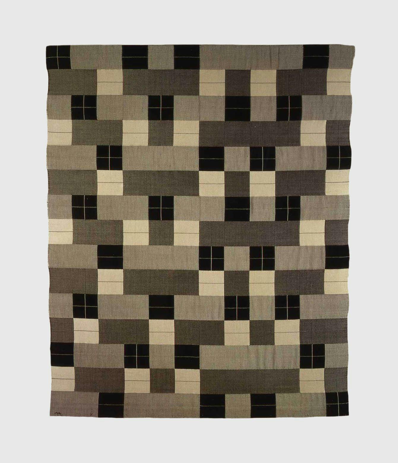 A textile by Anni Albers, titled Black White Gray, dated in 1927 and 1964.