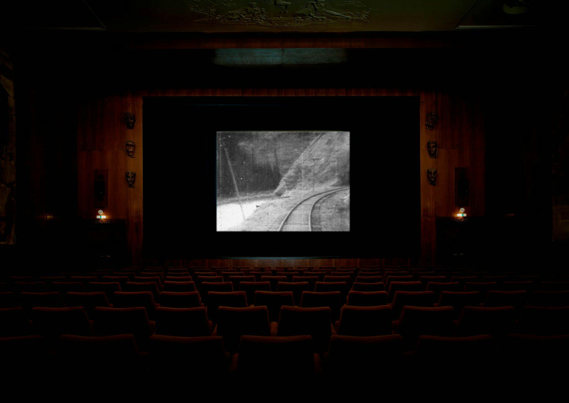 A single-channel 16mm film projection by Stan Douglas, titled Overture, dated 1986.