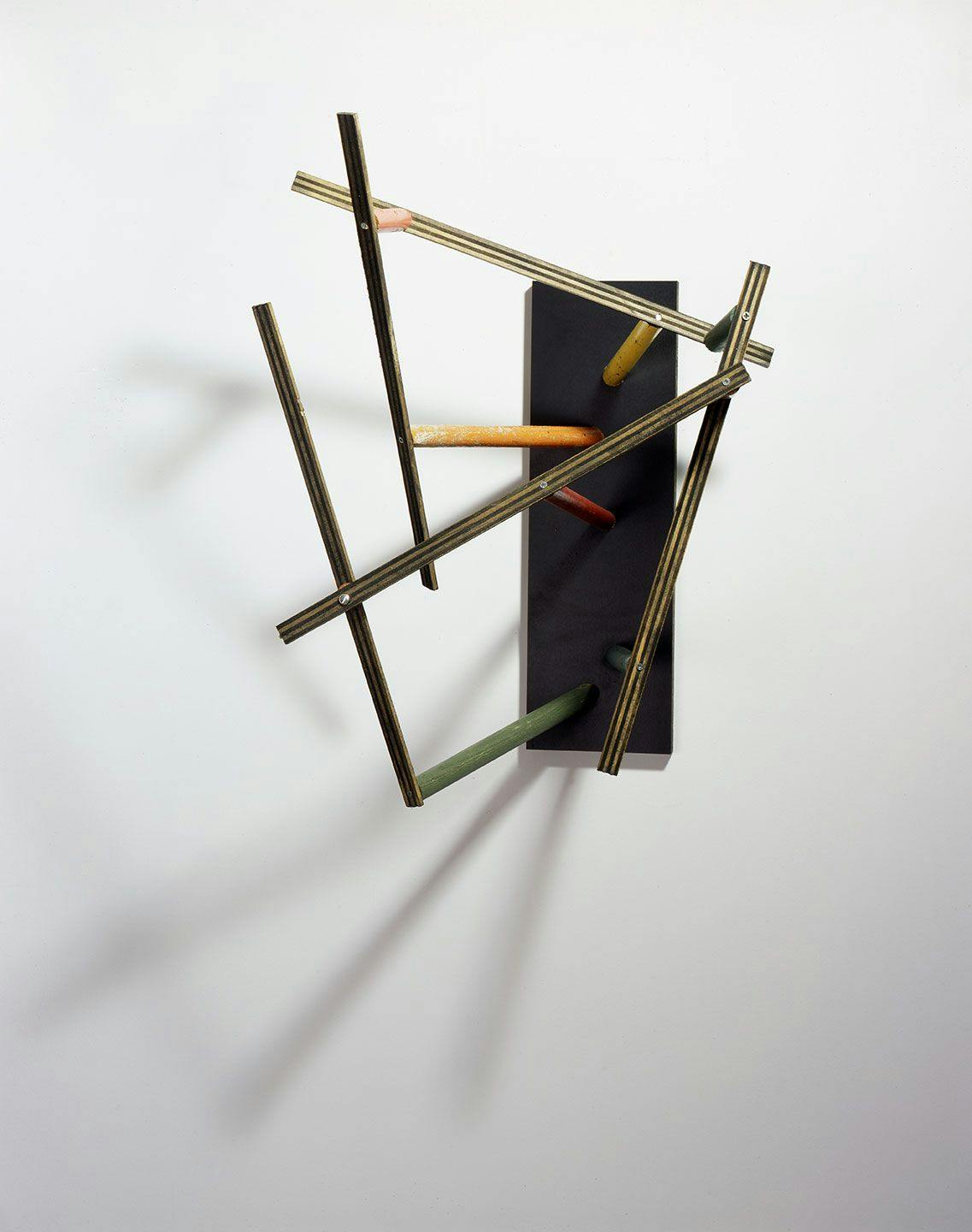 A mixed media, wall-mounted sculpture by Al Taylor, titled Untitled: (Latin Studies), dated 1985.