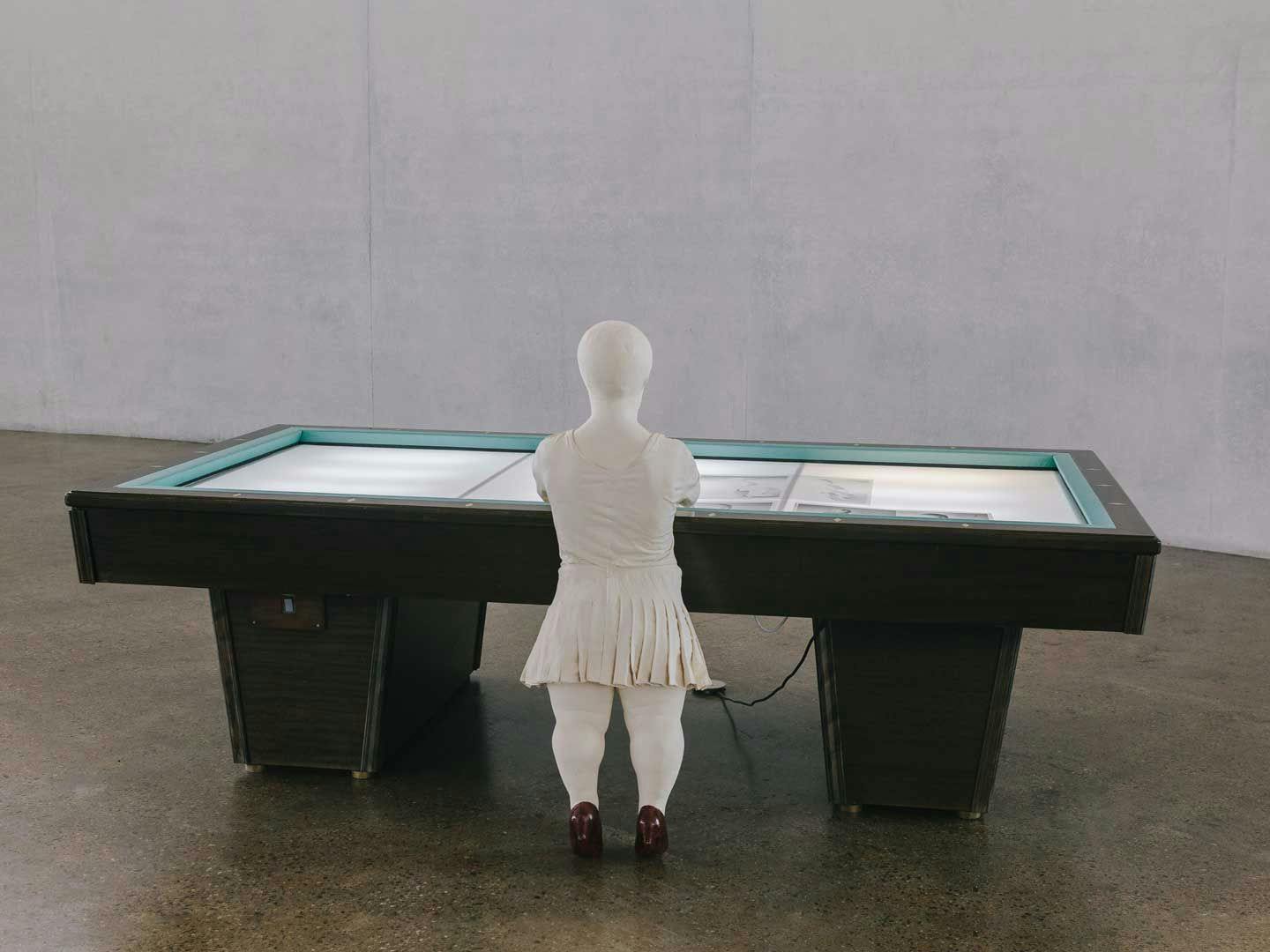A mixed media sculpture by Juan Muñoz, titled Sara with Billiard Table, dated 1996, in the Skulpturenhalle of the Thomas Schütte Foundation, in Neuss, Germany, in 2018. 