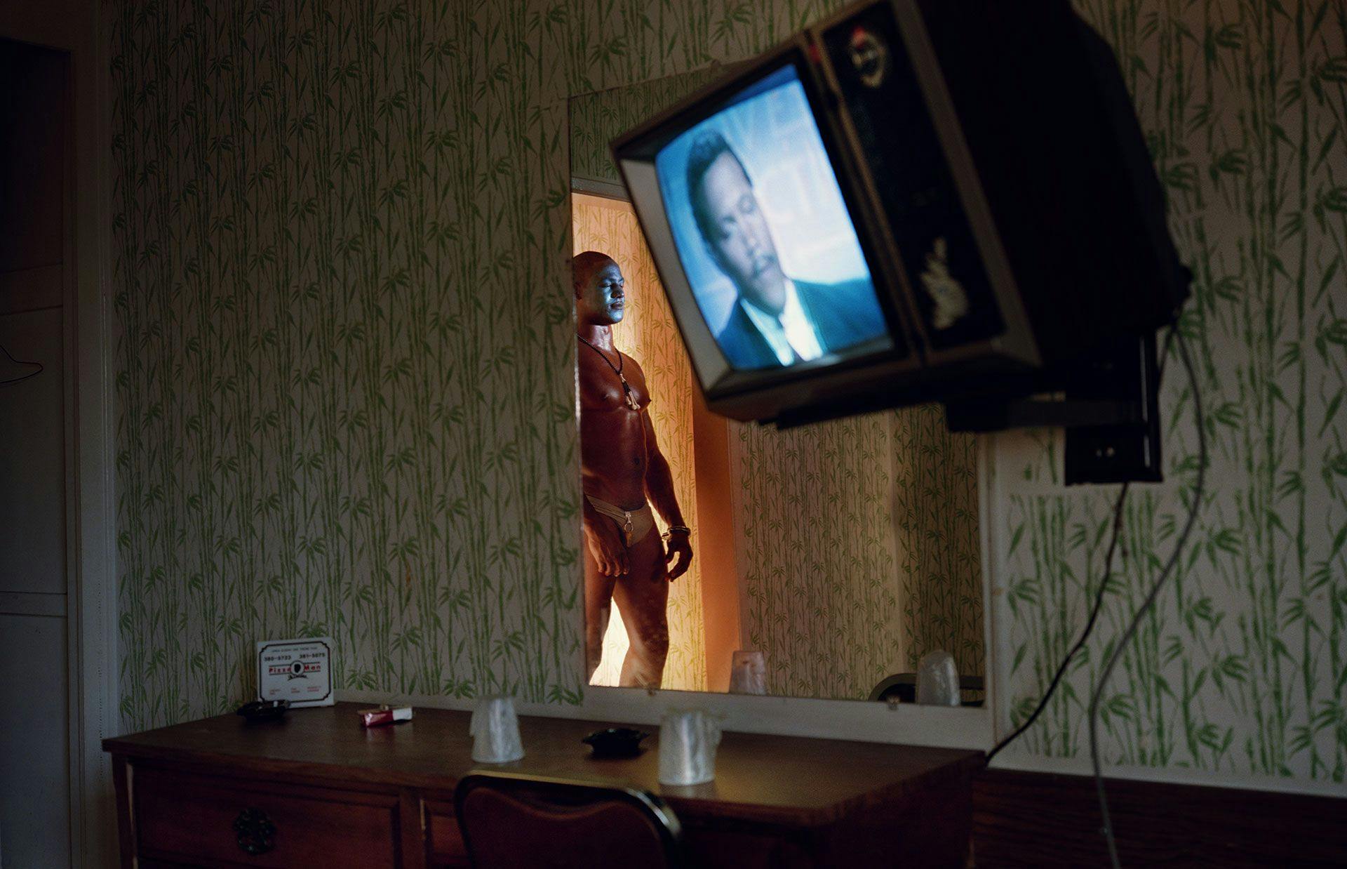 A photograph by Philip-Lorca diCorcia titled Gerald Hughes (a.k.a. Savage Fantasy), about 25 years old, Southern California, $50, dated 1990 to 1992.