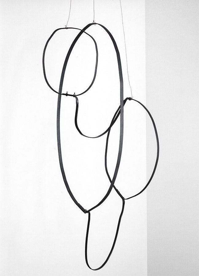 A hanging steel and wire sculpture by Al Taylor, titled Untitled: (Hanging Puddles), dated 1991.