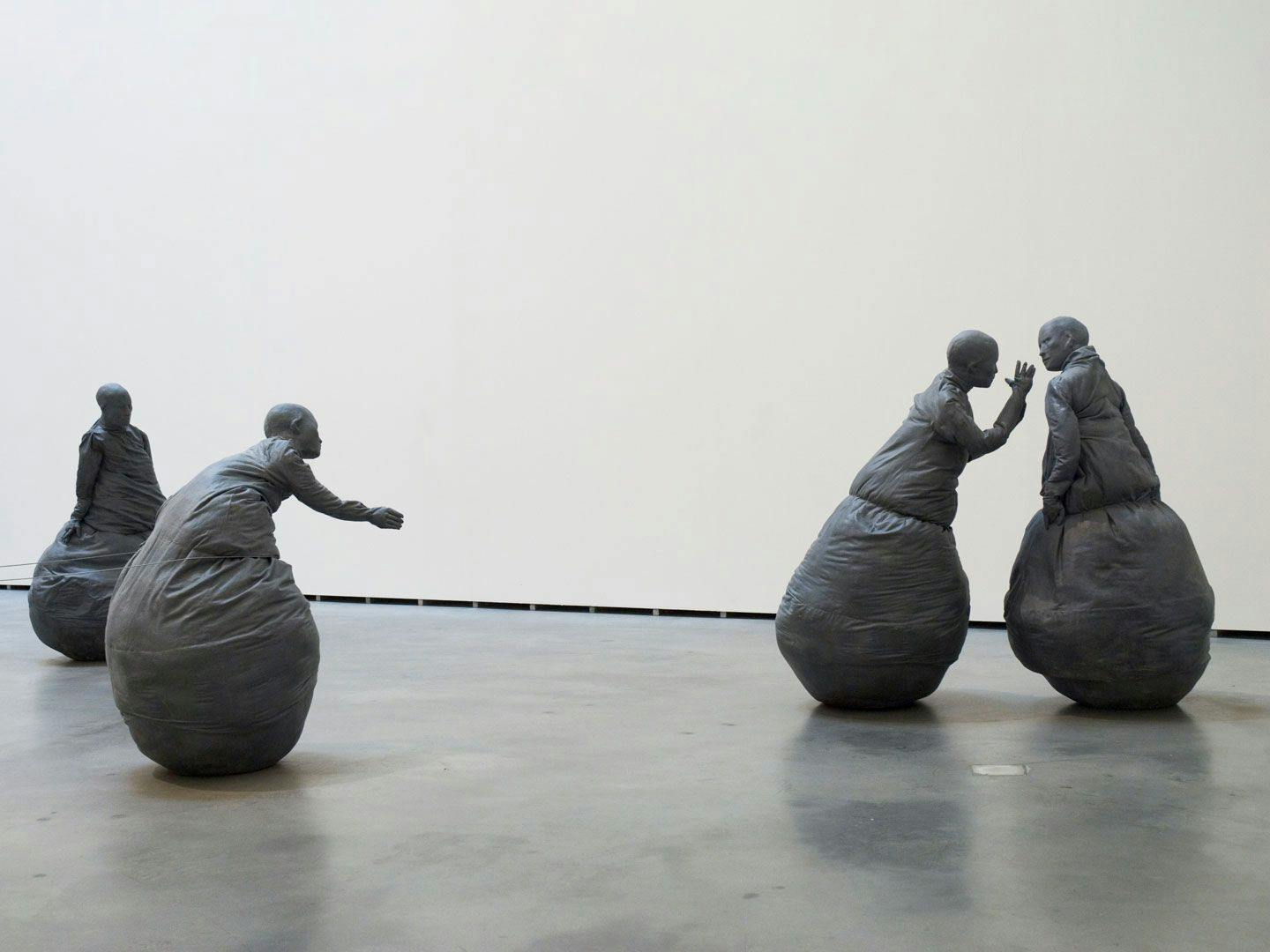 A mixed media sculptural installation by Juan Muñoz, titled Conversation Piece, dated 1996, at Guggenheim Bilbao Museoa, in Bilbao, Spain, in 2008.