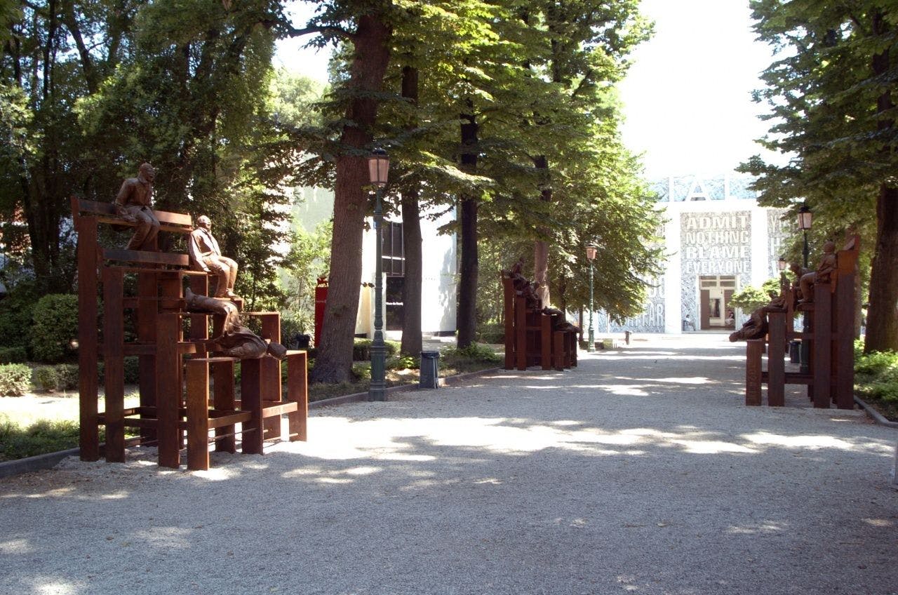 An outdoor sculpture by Juan Muñoz, titled Thirteen Laughing at Each Other, dated 2001, at the 51st Venice Biennale in Venice, Italy, in 2005.