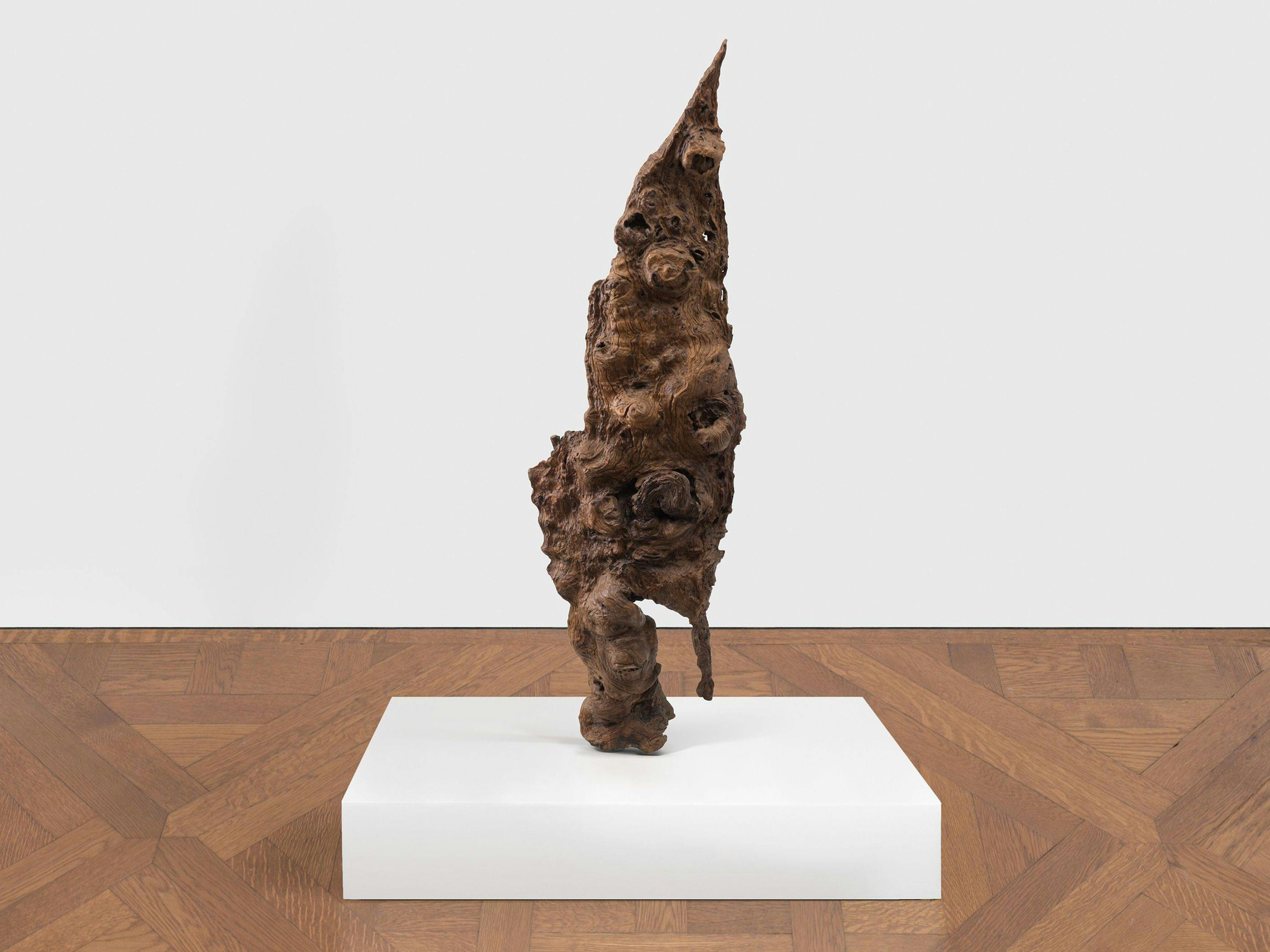 A burl wood sculpture by Sherrie Levine, titled Scholar Figure, dated 2023.