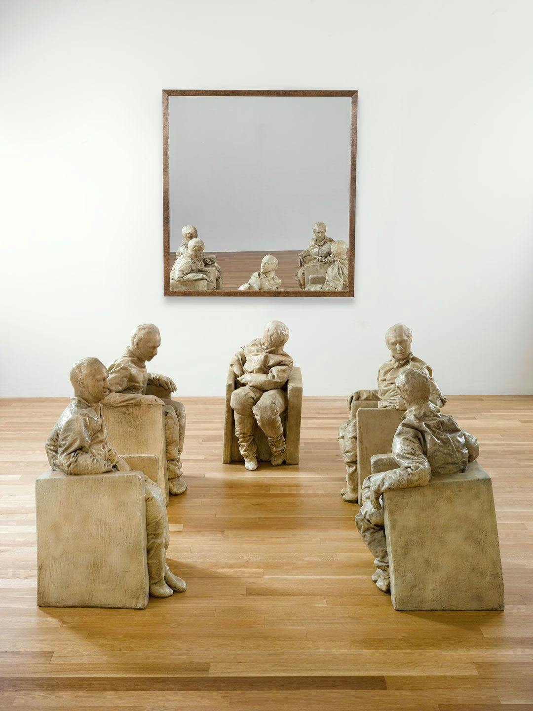 A mixed media sculptural installation by Juan Muñoz, titled Five Seated Figures, dated 1996.