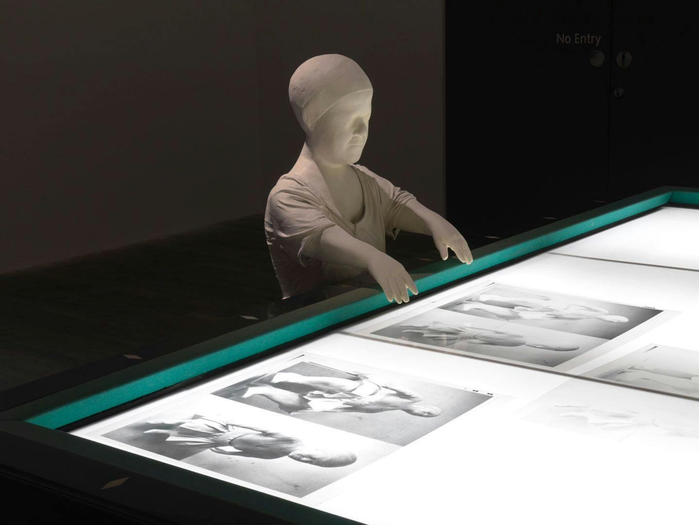 A mixed media sculpture by Juan Muñoz, titled Sara with Billiard Table, dated 1996, at Tate Modern, in London, England, in 2008. 