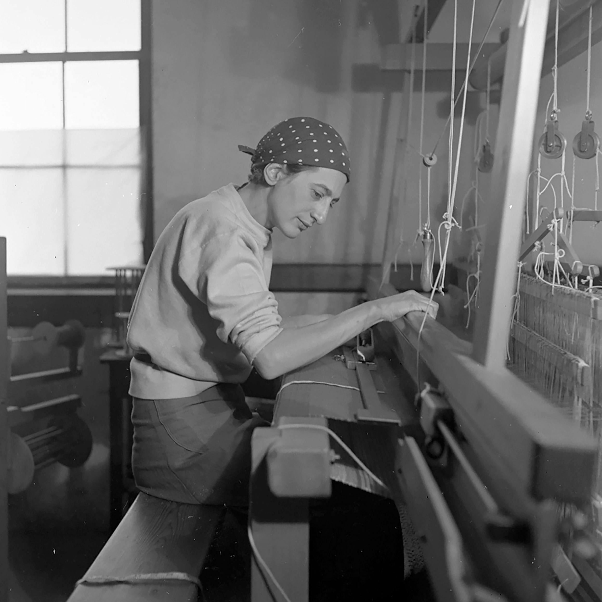 Anni Albers in her weaving studio at Black Mountain College, dated 1937.