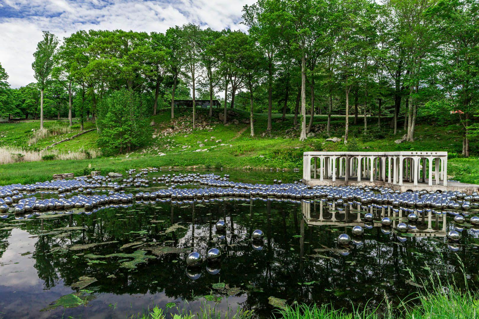 Installation view of the exhibition Yayoi Kusama: Narcissus Garden at the Philip Johnson Glass House in Connecticut, dated 2016.