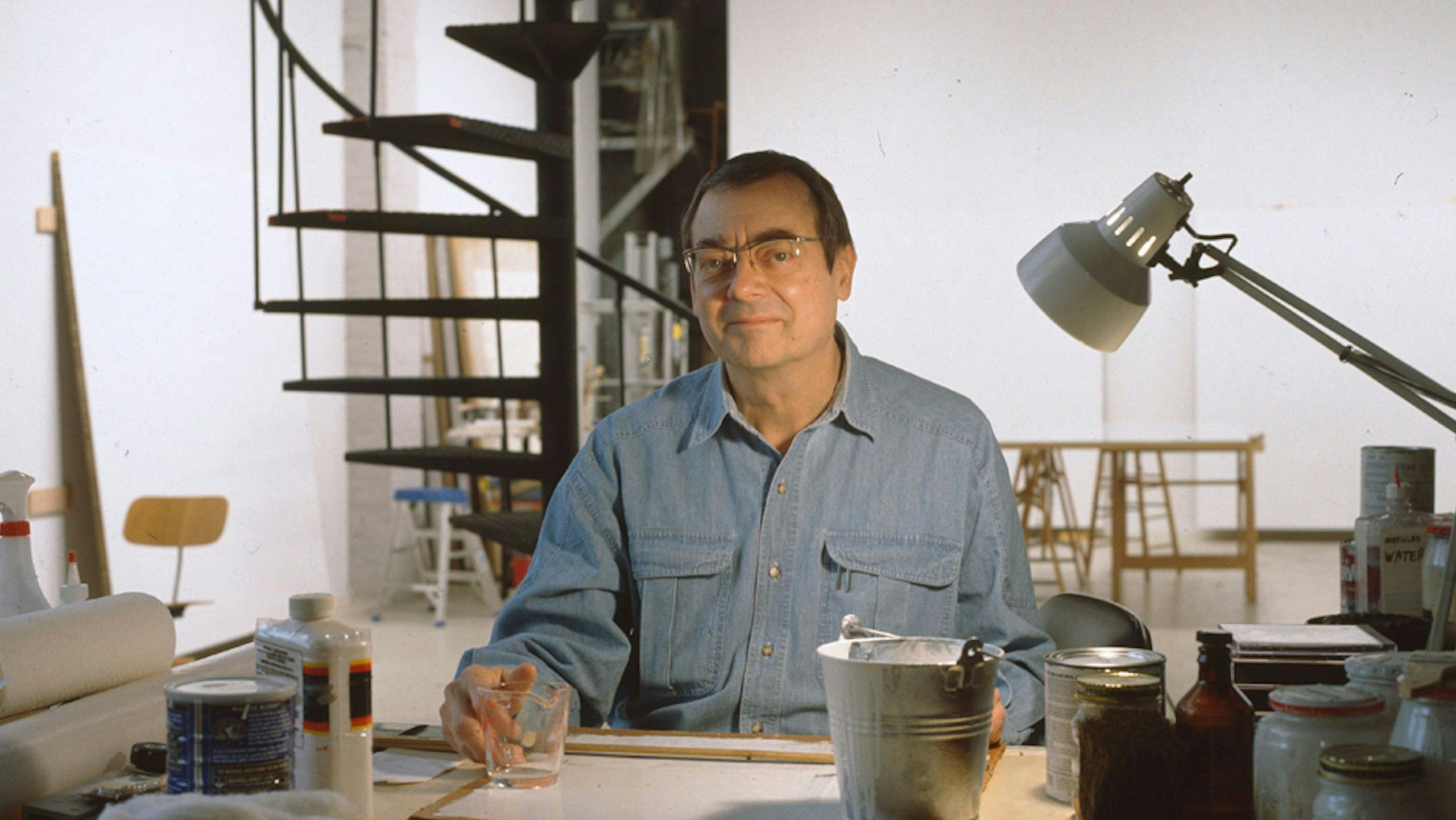 Photograph of Robert Ryman in his studio by Jacobson Studio, dated 1998.