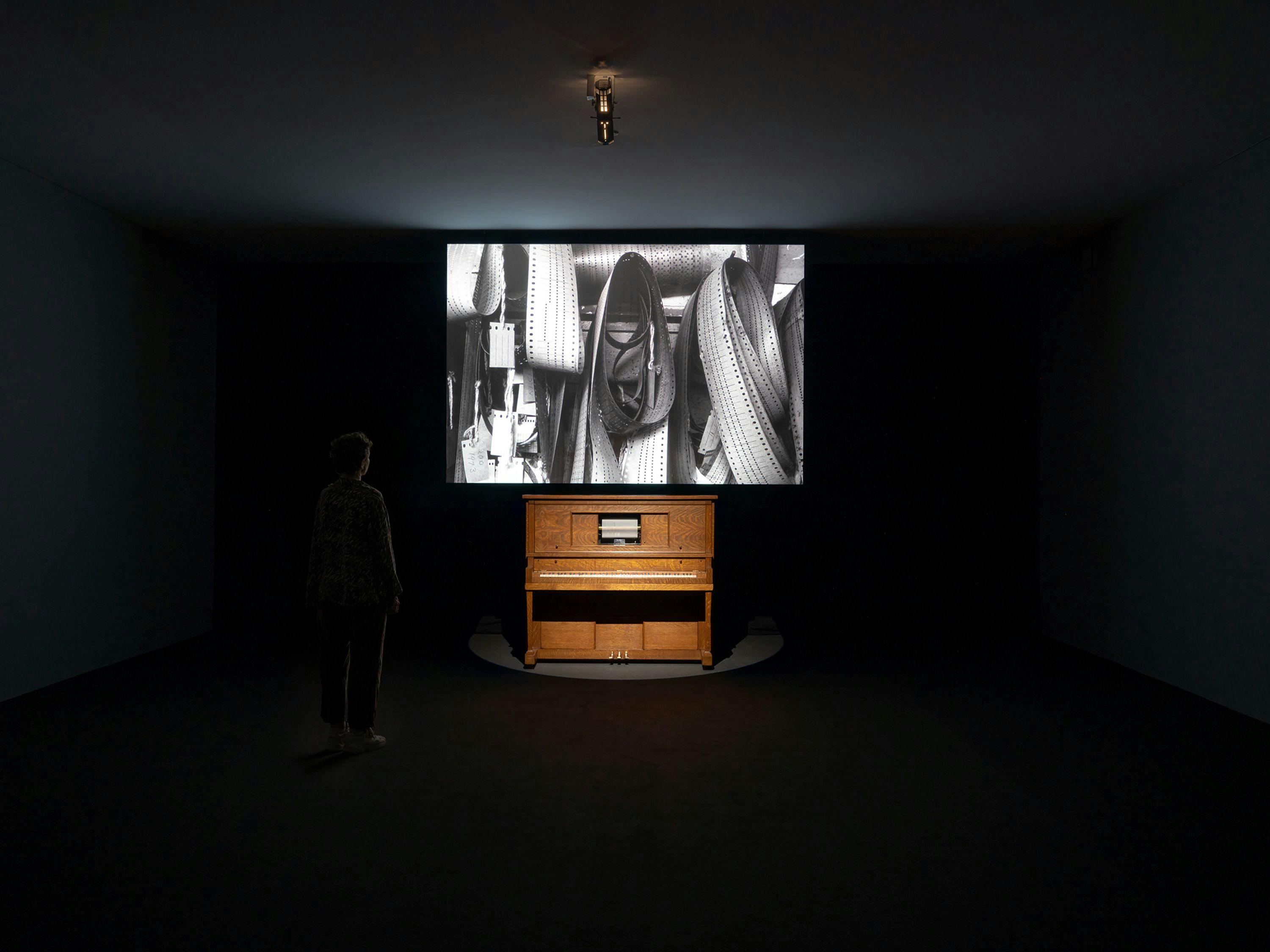 An installation view of a mixed media video by Stan Douglas Onomatopoeia, 1985 to 1986.