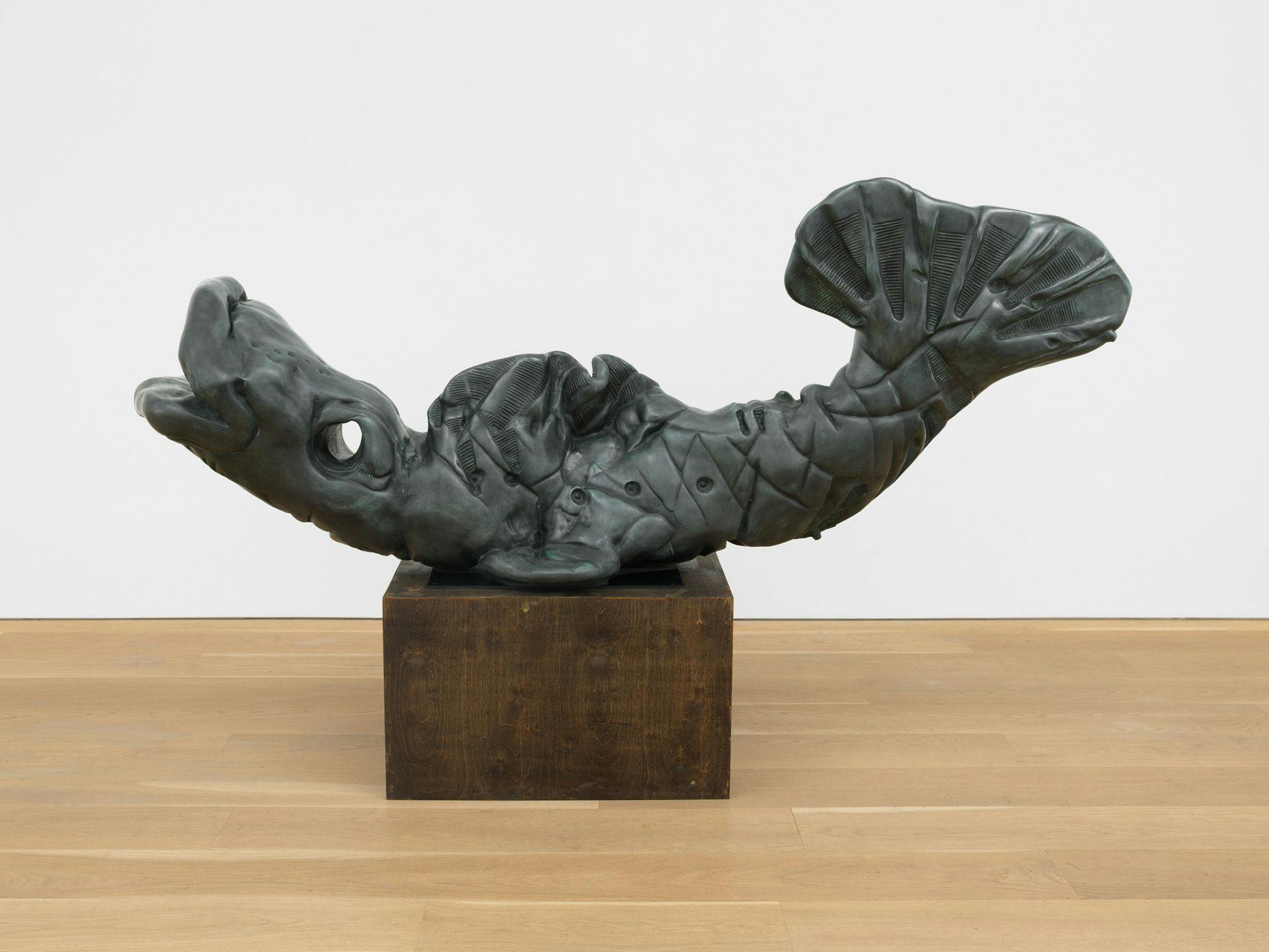 A bronze sculpture by Josh Smith, titled Happy Fish, dated 2011.