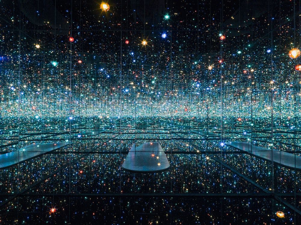 An installation by Yayoi Kusama, titled INFINITY MIRRORED ROOM - THE SOULS OF MILLIONS OF LIGHT YEARS AWAY, dated 2013.