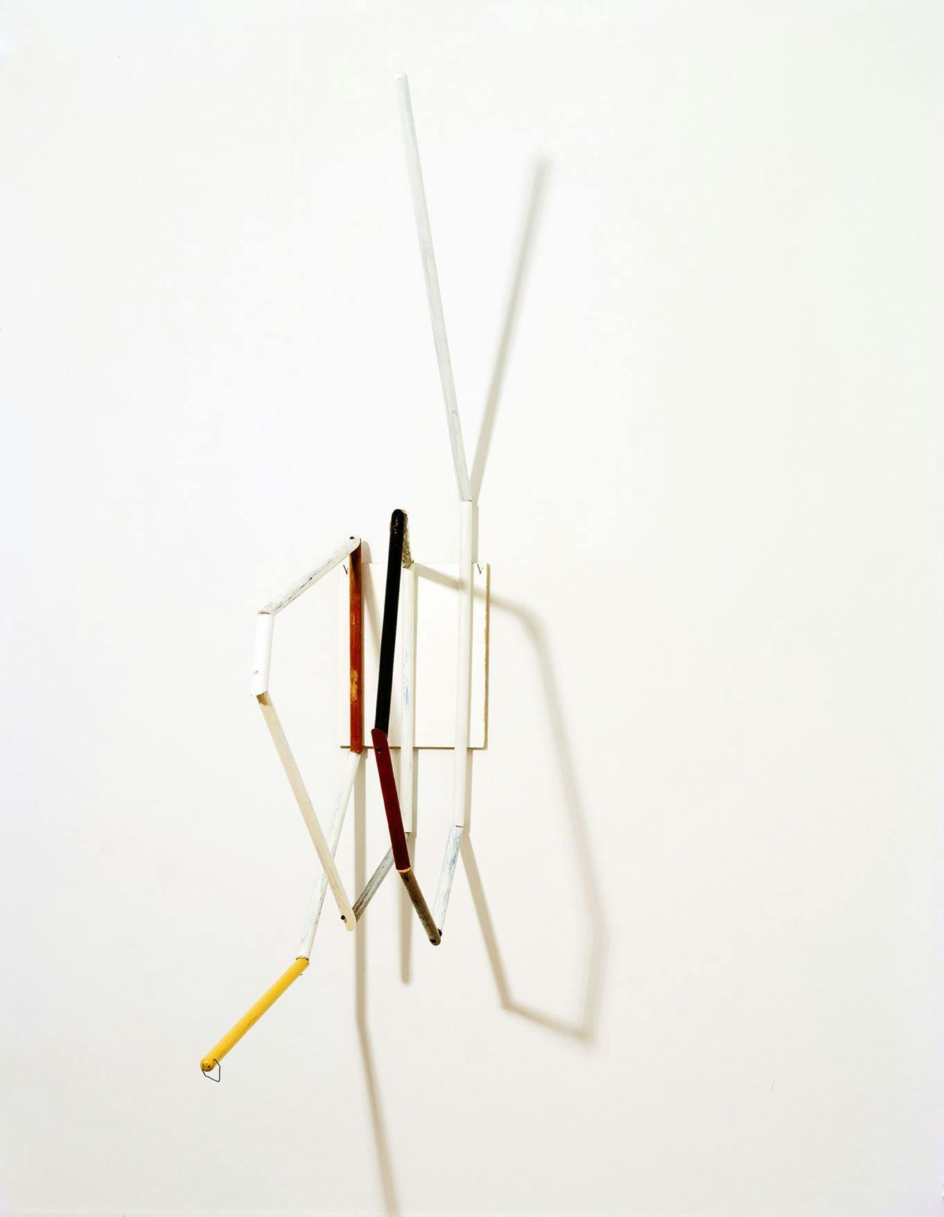 A mixed media, wall-mounted sculpture by Al Taylor, titled Distill, dated 1988.