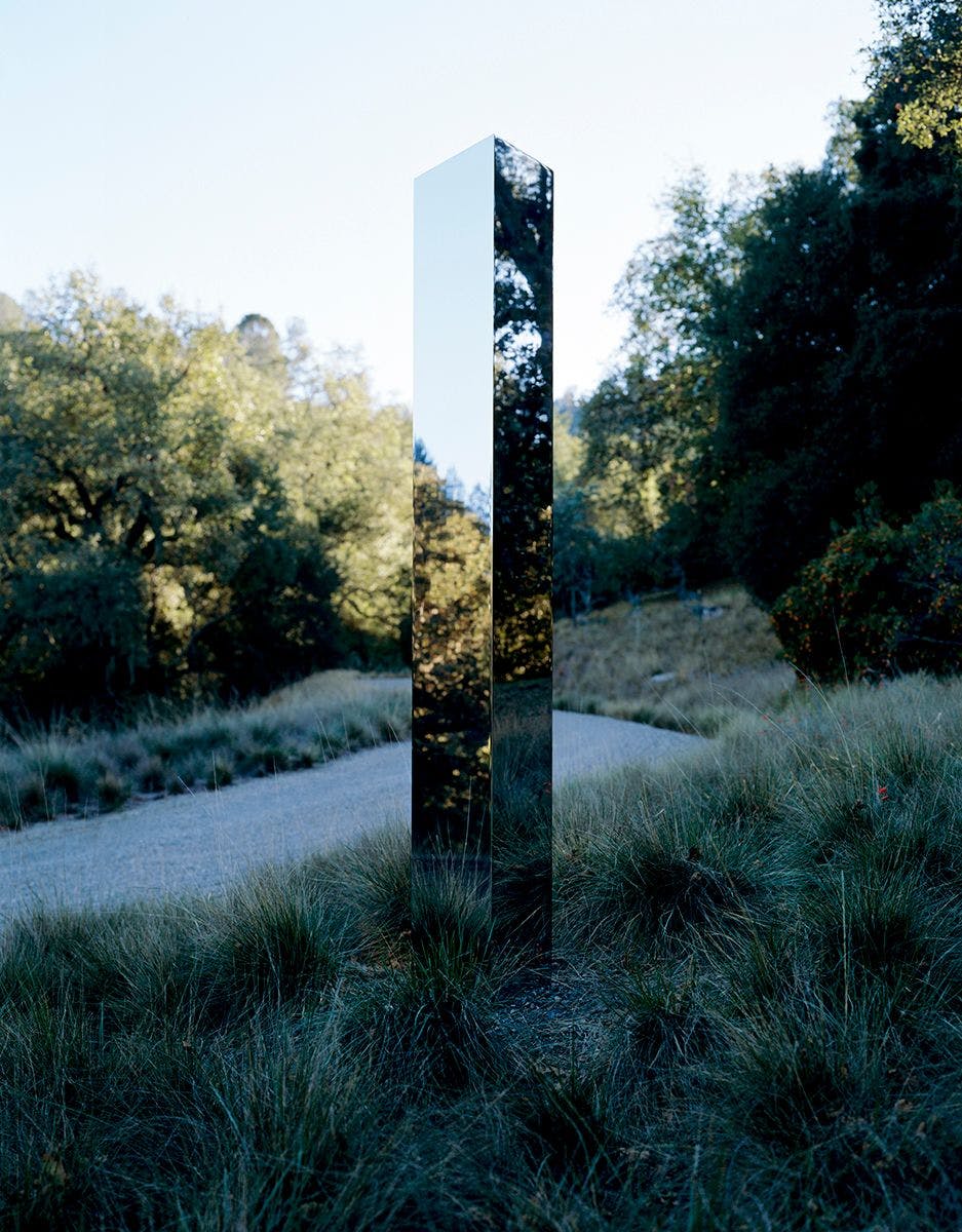 A stainless steel sculpture by John McCracken, titled Crystal, dated 1988.