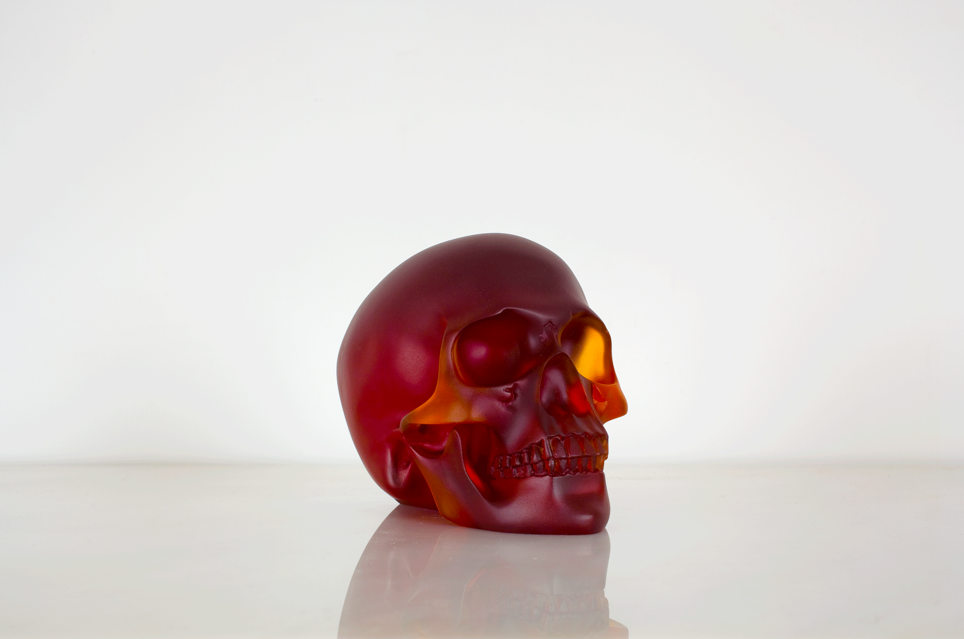A sculpture by Sherrie Levine, titled, Red Skull, dated 2011.