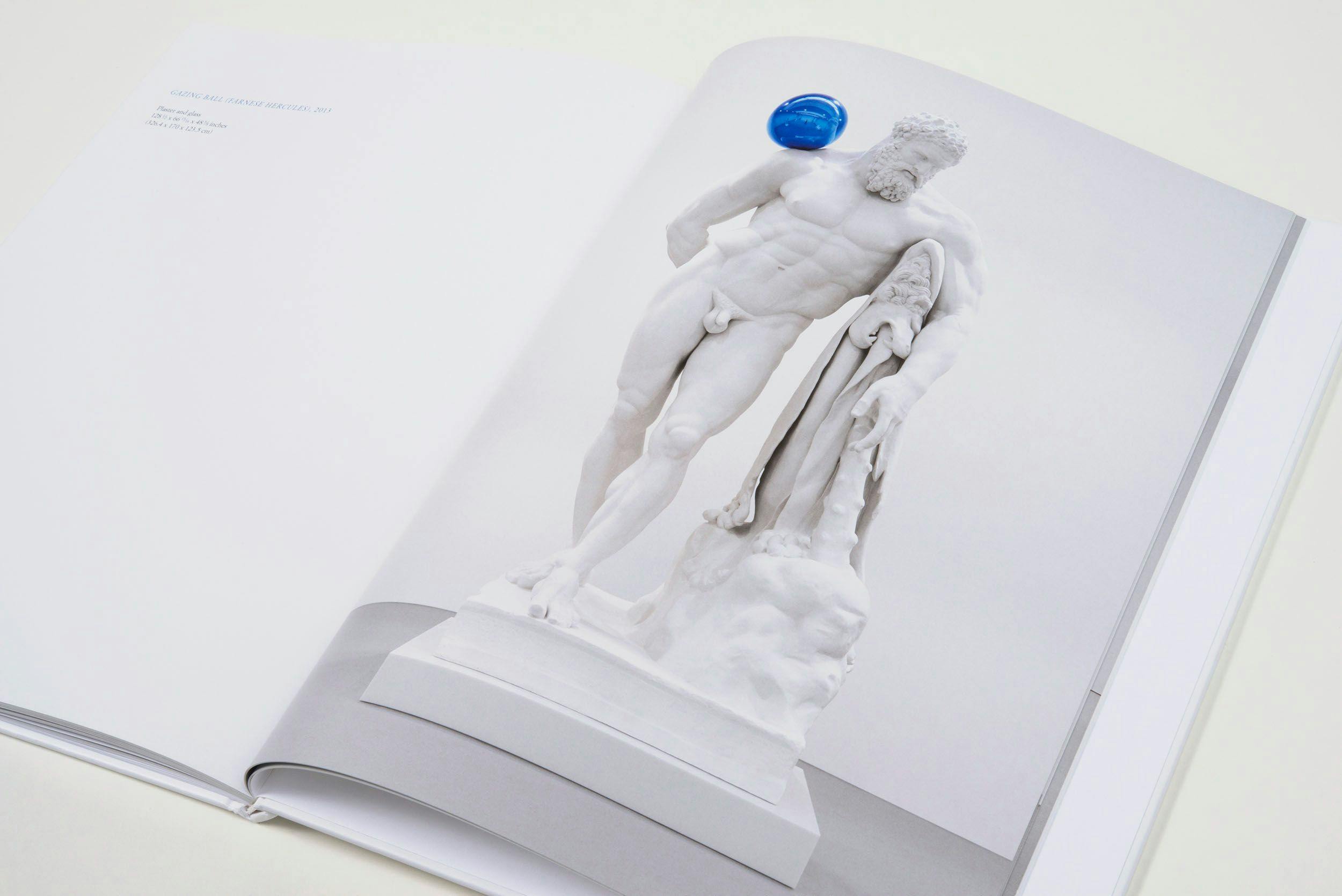 A photograph of a spread from the book Jeff Koons: Gazing Ball, dated 2014.
