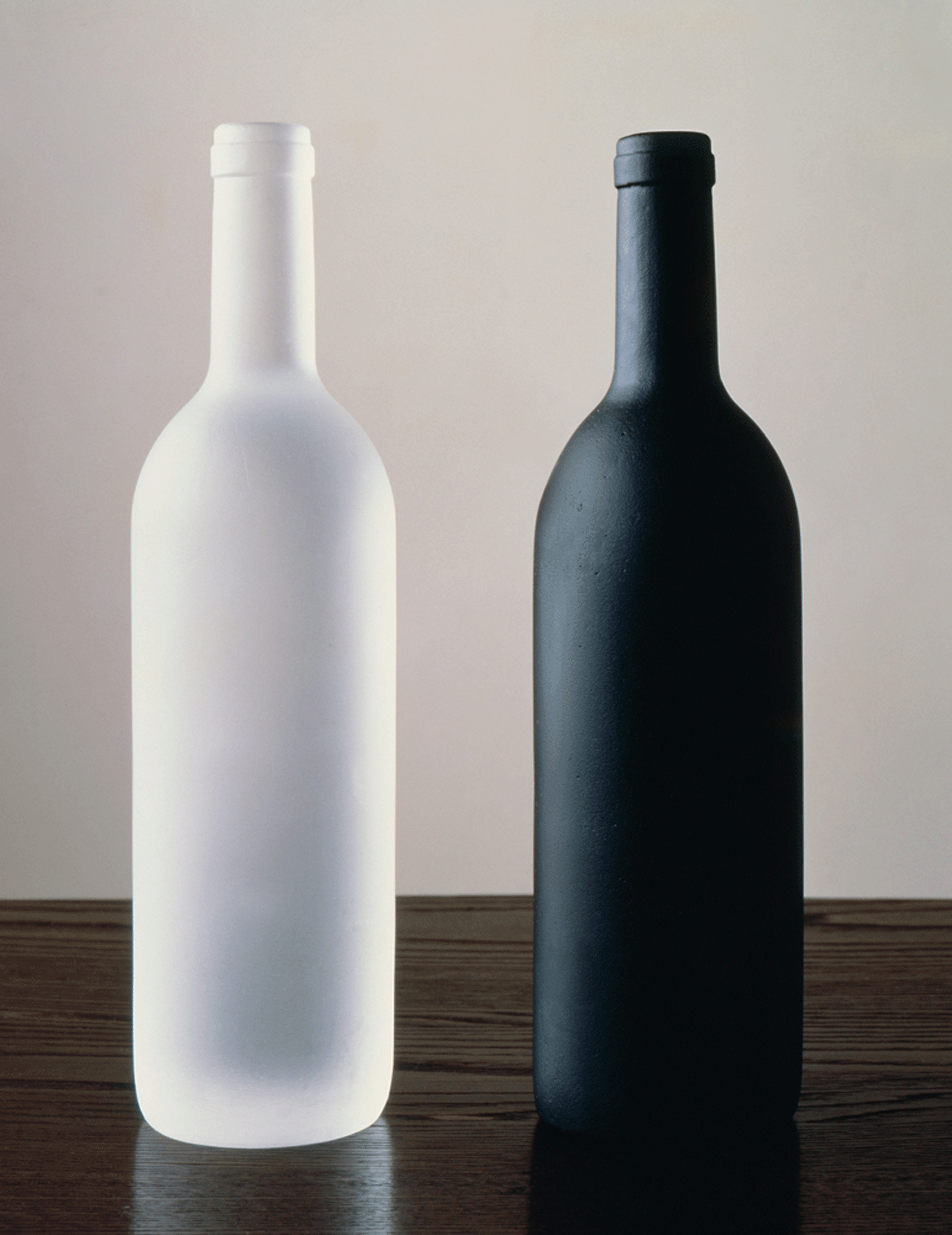 A sculpture by Sherrie Levine, titled, Black and White Bottles, dated 1992.