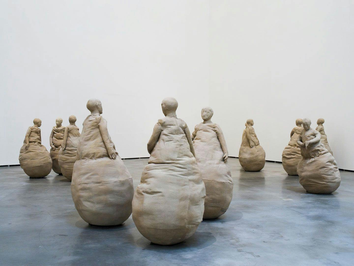 A mixed media sculptural installation by Juan Muñoz, titled Conversation Piece, Dublin, dated 1994, at Guggenheim Bilbao Museoa, in Bilbao, Spain, in 2008.