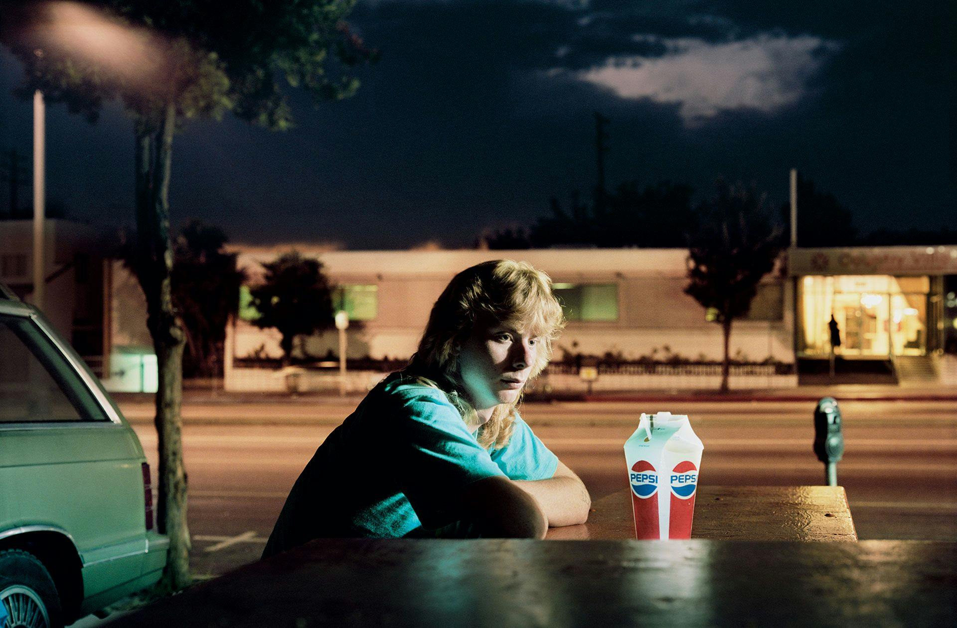 A photograph by Philip-Lorca diCorcia titled Brent Booth; 21 years old; Des Moines, Iowa, dated 1990 to 1992.